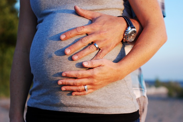 Pregnant woman with her hand on her belly